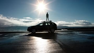 Person standing on car