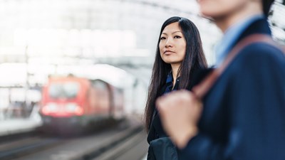 Man and woman waiting for train 