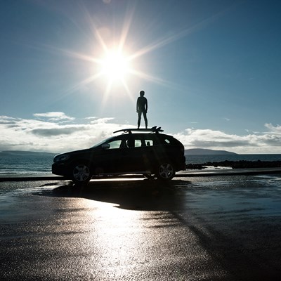 Man standing on car 