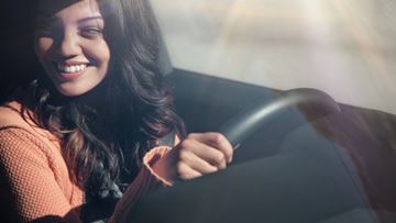 Young Woman Brown Hair Behind Steering Wheel