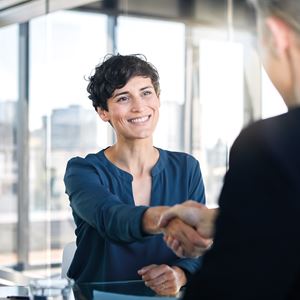 Young Woman Handshake Closing A Deal