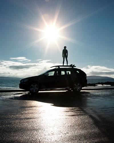 Person standing on car