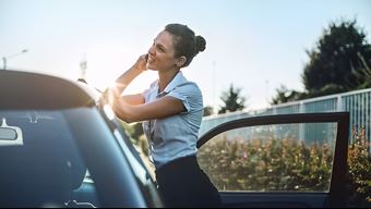 Women calling next to her leasecar